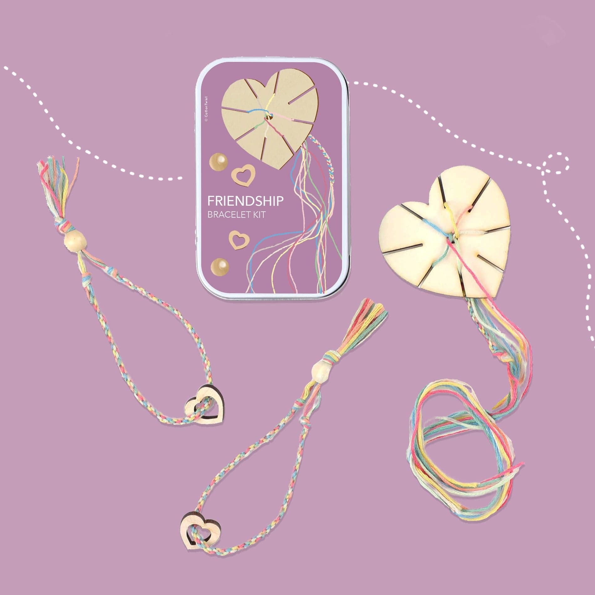 Small friendship-bracelet gift tin with two wooden heart weaving tools, pastel threads, beads and wooden heart charms