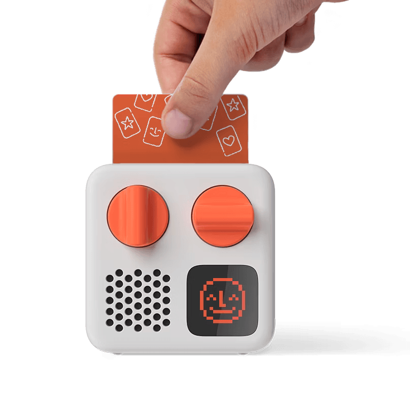 White and orange Yoto Mini portable audio player shown from the front