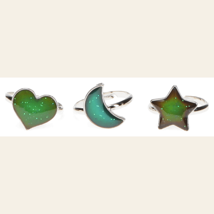 Three colour-changing mood rings with heart, moon and star designs